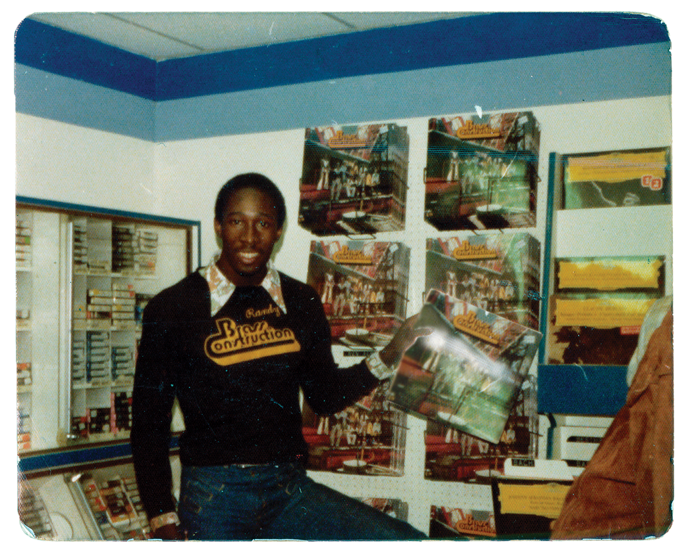 Randy Muller, in a record store, holding Brass Construction’s debut album. Photo courtesy of Randy Muller.